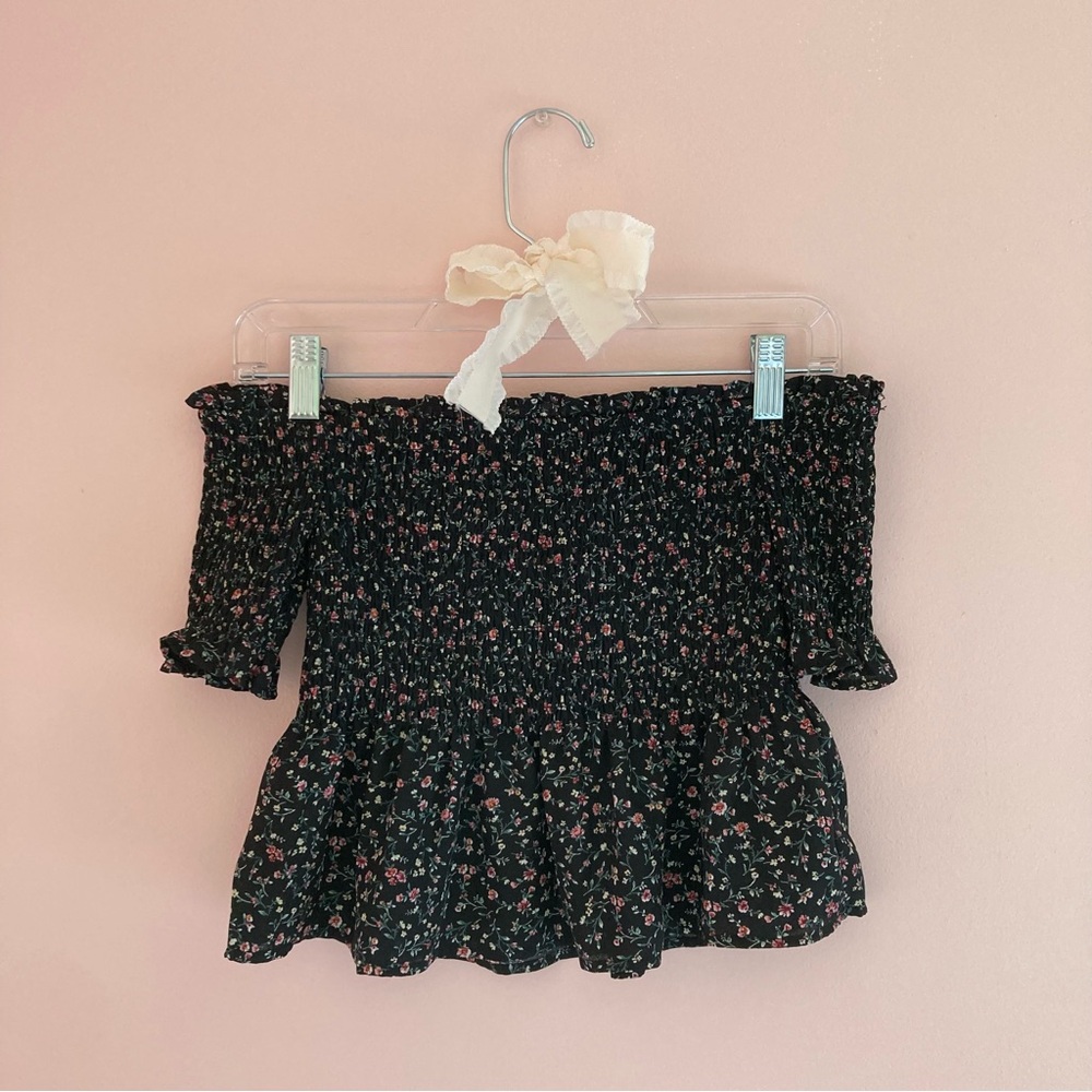 Francesca’s off-the-shoulder black floral blouse